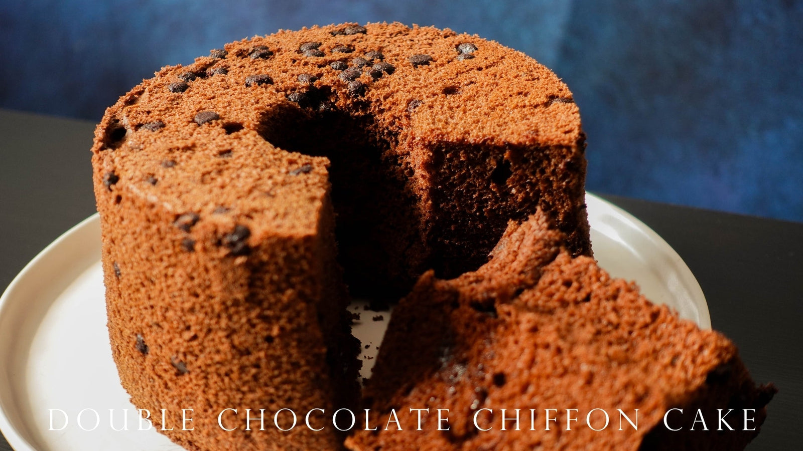 Double chocolate chiffon cake sliced on a white plate