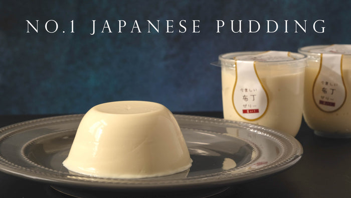 Japanese milk pudding on a silver plate beside labelled pudding cups