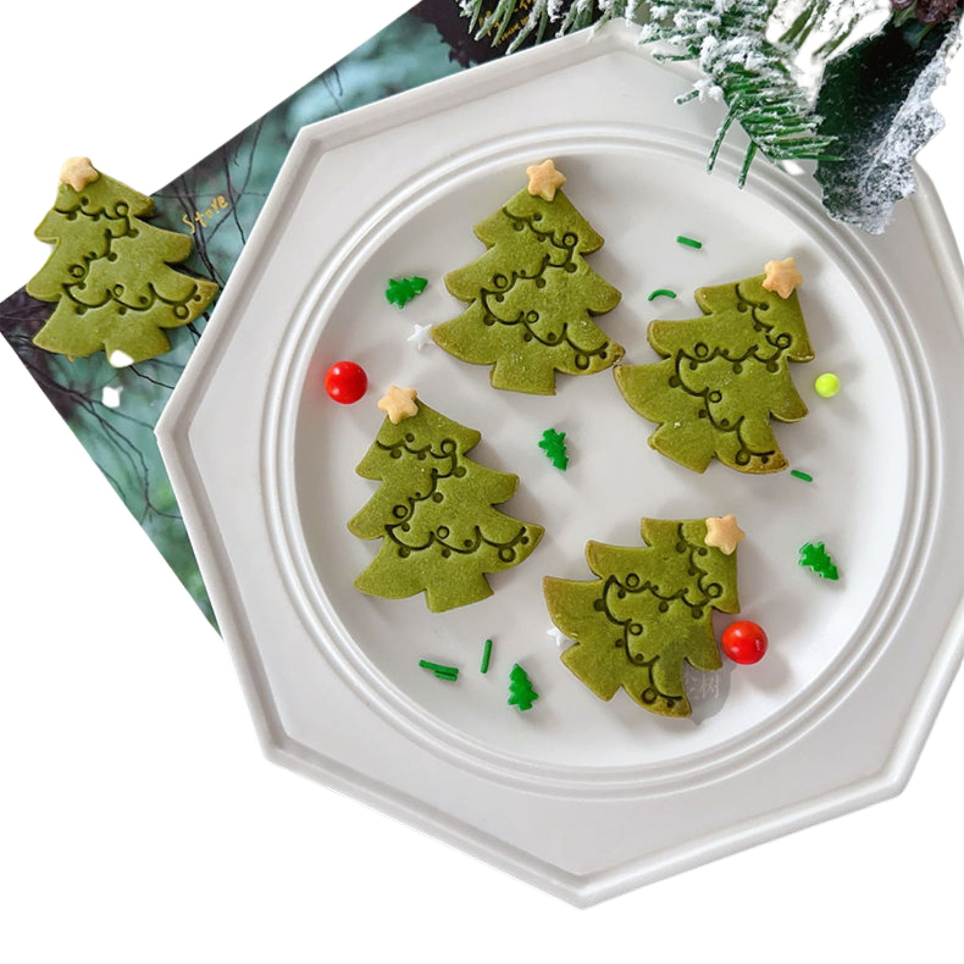 Premium Photo  Christmas baking. fir trees with decoration, flour, spices  and cookies molds on a cutting board. beautiful cookies with decor on green  surface