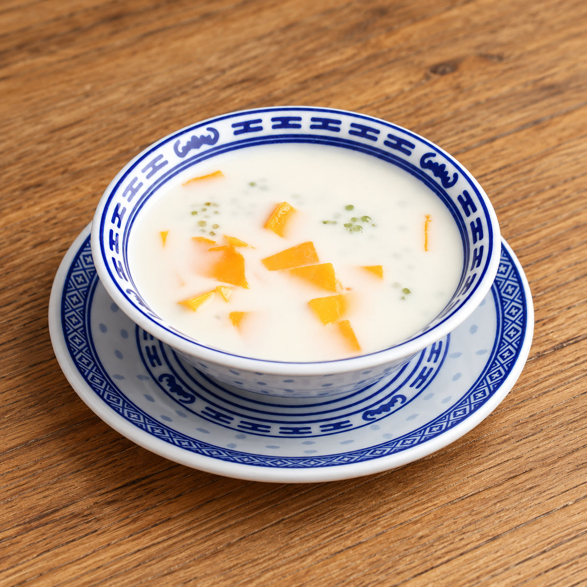 Mango dessert served in a blue-and-white Linglong porcelain bowl; tableware sold individually
