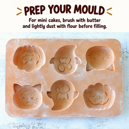 Orange Halloween silicone mould lightly buttered and dusted with flour before adding cake batter.