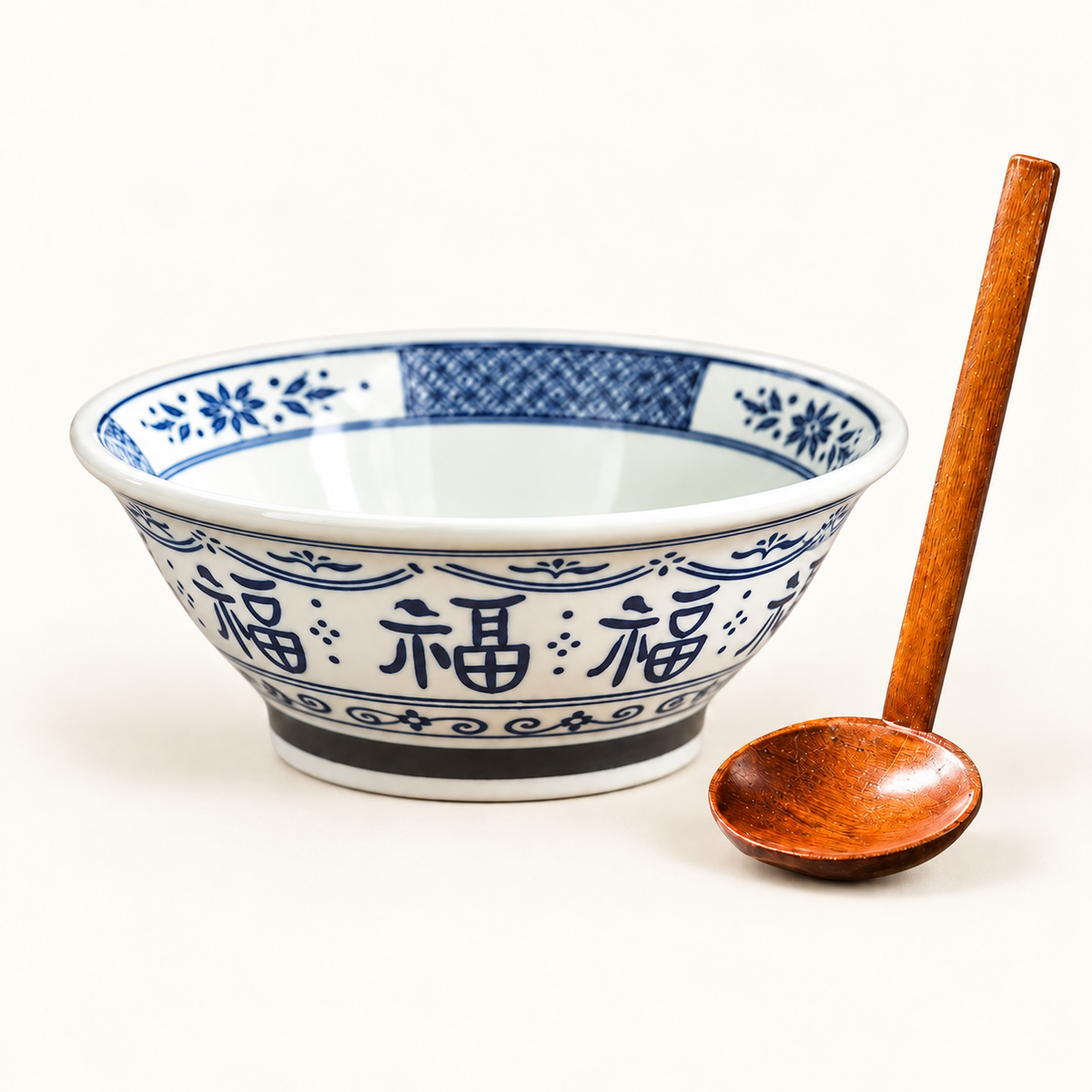 Blue 7-inch Good Fortune bowl with wooden spoon on ivory background