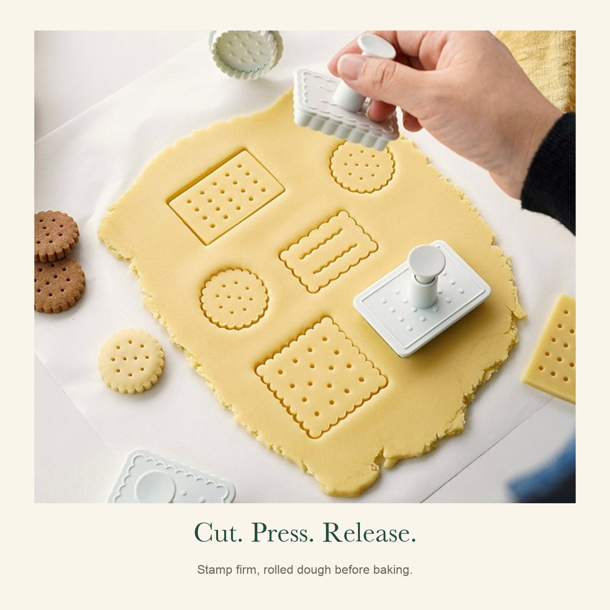 Press-down biscuit stamp and cutter in use on rolled dough, showing dotted and wavy patterns