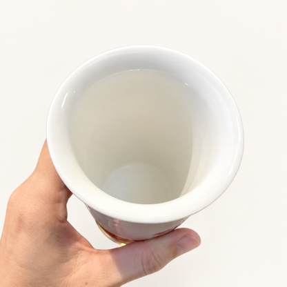 White ceramic interior and flared rim of the 350 ml milk tea cup