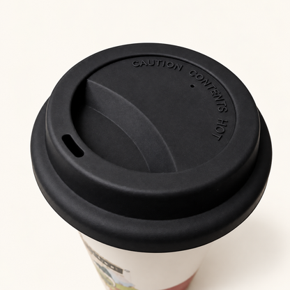 Black sipping lid with drinking opening and embossed hot contents warning