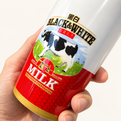 Close-up of the cow illustration and red patterned cup exterior