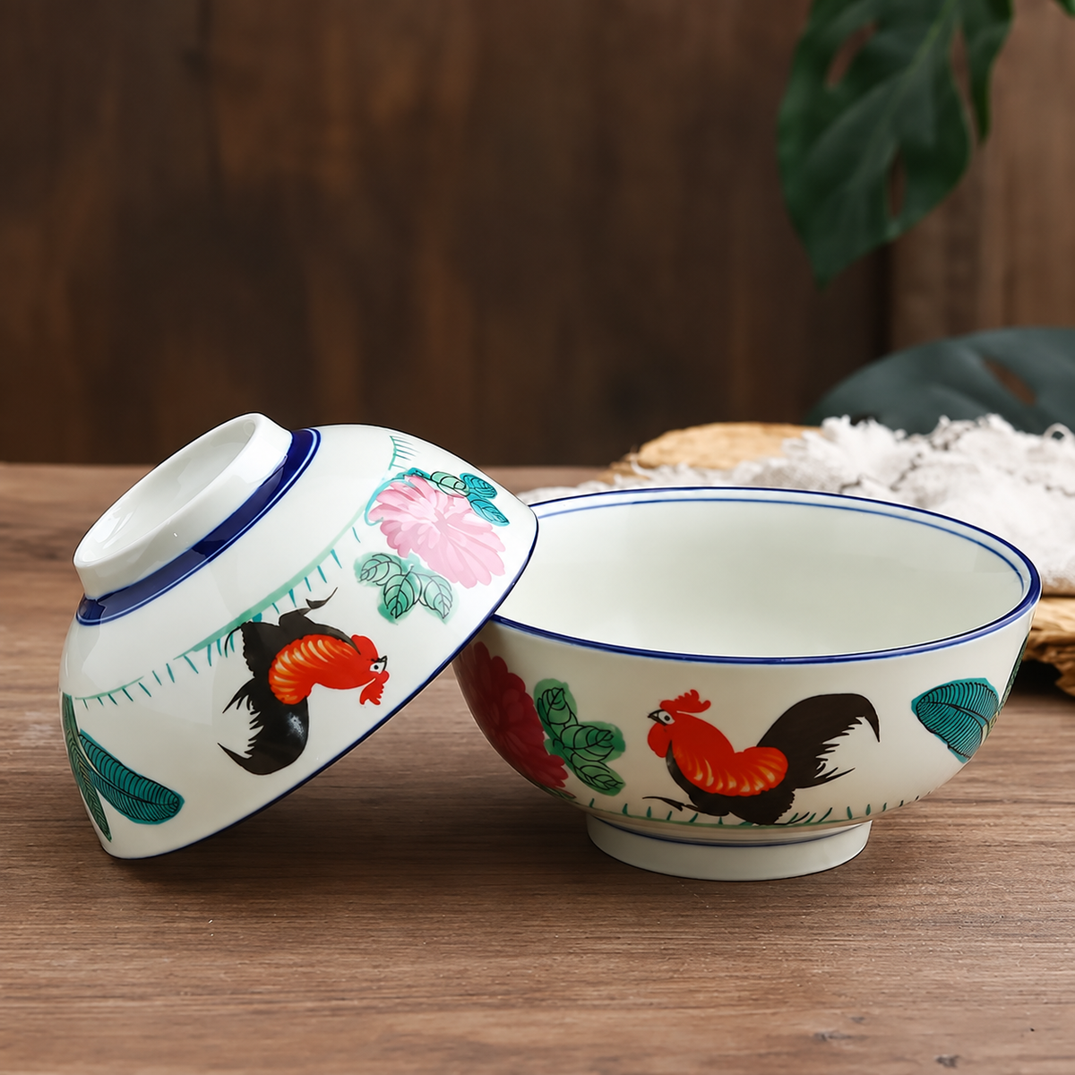 Rounded rooster bowls on a wooden table