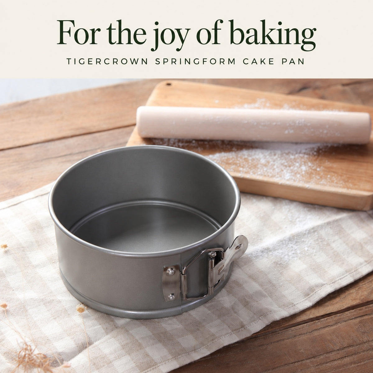 TIGERCROWN springform cake pan on a linen cloth and wooden board.