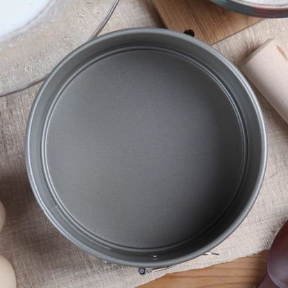 Top view of the TIGERCROWN springform cake pan showing the coated interior and removable round base.